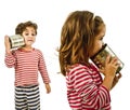 Two kids talking on a tin phone Royalty Free Stock Photo