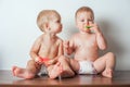 Two kids toddlers eat Yummy watermelons in diapers close-up and copy space Royalty Free Stock Photo