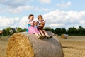 Two kids, boy and girl in traditional Bavarian costumes in wheat field Royalty Free Stock Photo