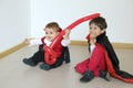 Two kids with vampire costume enyoing in a party