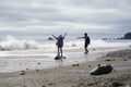 Two kids playing on Rialto Beach Olympic National Washington Royalty Free Stock Photo