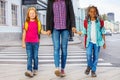 Two kids with woman walking on the street Royalty Free Stock Photo