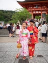 Two kimono's girl post at gate of kiyomizu-dera temple