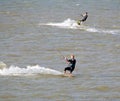 Two kitesurfers