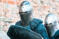 Two knights in armor. The historical restoration of military events Royalty Free Stock Photo