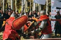 Two knights fight each other with swords. Festival of jousting tournaments. Royalty Free Stock Photo