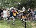 Two knights with swords fight in the ring at the Purim festival with King Arthur in Jerusalem city, Israel