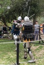 Two knights with swords fight in the ring at the Purim festival with King Arthur in Jerusalem city, Israel