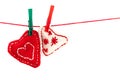 Two knitted hearts on a red string