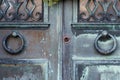 Two Knocker Rings on Vintage rustic Door. Antique Door Knobs. Royalty Free Stock Photo