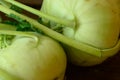 Two kohlrabies on wooden background