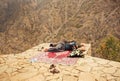 Two kurdish men sleeping over a precipice in mountaine village