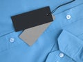 Two label price tags mock-up on blue shirt.