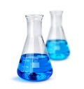 Two laboratory glass beakers with liquid samples Royalty Free Stock Photo