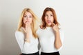 Two ladies in awkward moment. Royalty Free Stock Photo