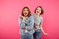 Two ladies friends standing isolated have fun. Royalty Free Stock Photo