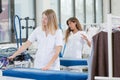 Two ladies working in dry cleaners