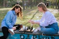 Two lady playing chess and having a chat Royalty Free Stock Photo