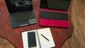Two laptops, notepad,  phone and pen, on a wooden table top view of flat objects Royalty Free Stock Photo