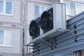 Two large black industrial fans from the air conditioner