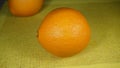 Two large bright Spanish oranges on the table