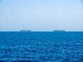 Two large cargo ships carrying containers by sea. Royalty Free Stock Photo