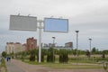 Large city billboards on the background of the city and the cloudy, gloomy Northern sky