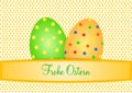 Two large colorful Easter eggs on small orange eggs with German lettering Royalty Free Stock Photo