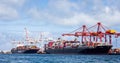 Two large container ships loading at the port in Freemantle, Australia