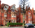 Two large handsome red brick buildings in hove. Royalty Free Stock Photo