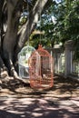 Two large hanging birdcages on a tree on Murray Street, Perth City
