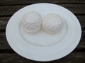Two large marshmallow balls on a white plate Royalty Free Stock Photo