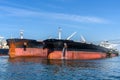 Two large oil tanker in a harbour under blue sky Royalty Free Stock Photo