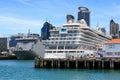 A cruise liner and a New Zealand Navy ship in the port of Auckland