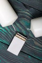 Two large white candles. Between them is a box of matches. Love and Togetherness Objects. On painted boards Royalty Free Stock Photo