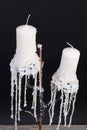 Two white candlesticks, decorative candle holder