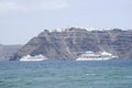 Two large white passenger ships between the islands of Santorini and Nea Kameni Royalty Free Stock Photo