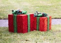 Two large Wrapped Christmas presant decorations outside on front lawn