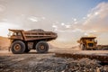 Two very large Mining Dump Trucks for transporting ore rocks Royalty Free Stock Photo