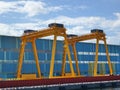 Two Large Yellow Gantry Cranes