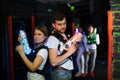 Two laser tag players standing back to back Royalty Free Stock Photo