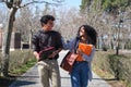 Two latin students talking and smiling at the college campus Royalty Free Stock Photo