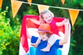 Two laughing funny kids Dutch football supporters Royalty Free Stock Photo