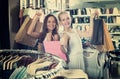 Two laughing girls having many shopping bags Royalty Free Stock Photo