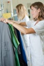 Two laundress preparing clothes