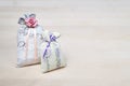 Two lavender scent sachets on wooden board or table. Scented pouches on wood with copy space. Fragrant bags for fresh home. Royalty Free Stock Photo