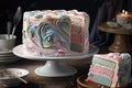 two-layer cake, frosted with swirls of pastel pink and blue icing