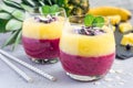 Two layer smoothie for breakfast in glass, horizontal