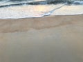 Two layers of brown sand beach with sea waves Royalty Free Stock Photo