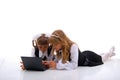 Two Laying Girl And Laptop. Royalty Free Stock Photo